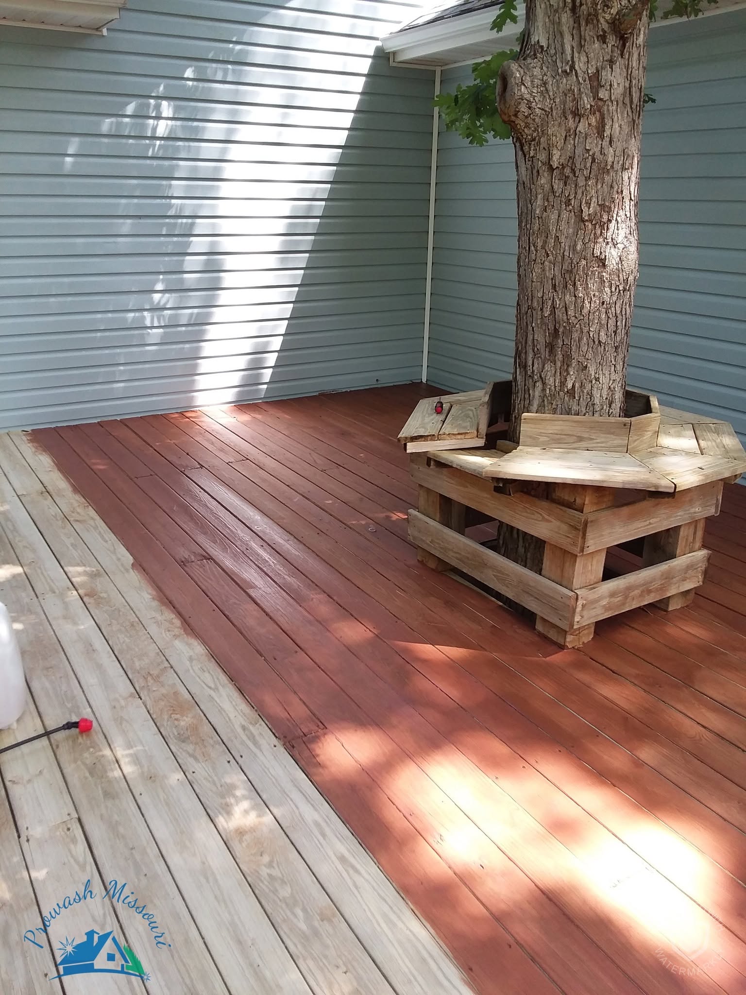 Clean outdoor deck and woodwork around a covered patio.