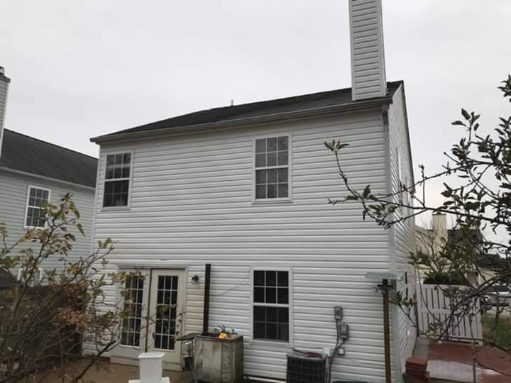 Clean white home exterior after Prowash Missouri exterior washing.