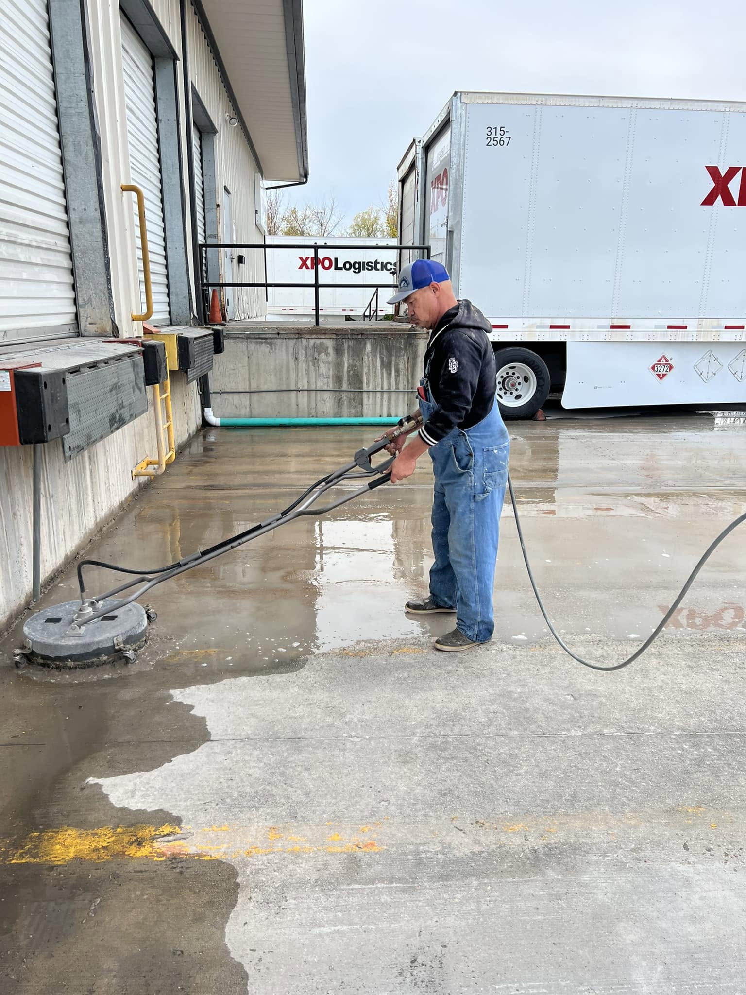 Prowash Missouri operator surface cleaning a concrete loading area.