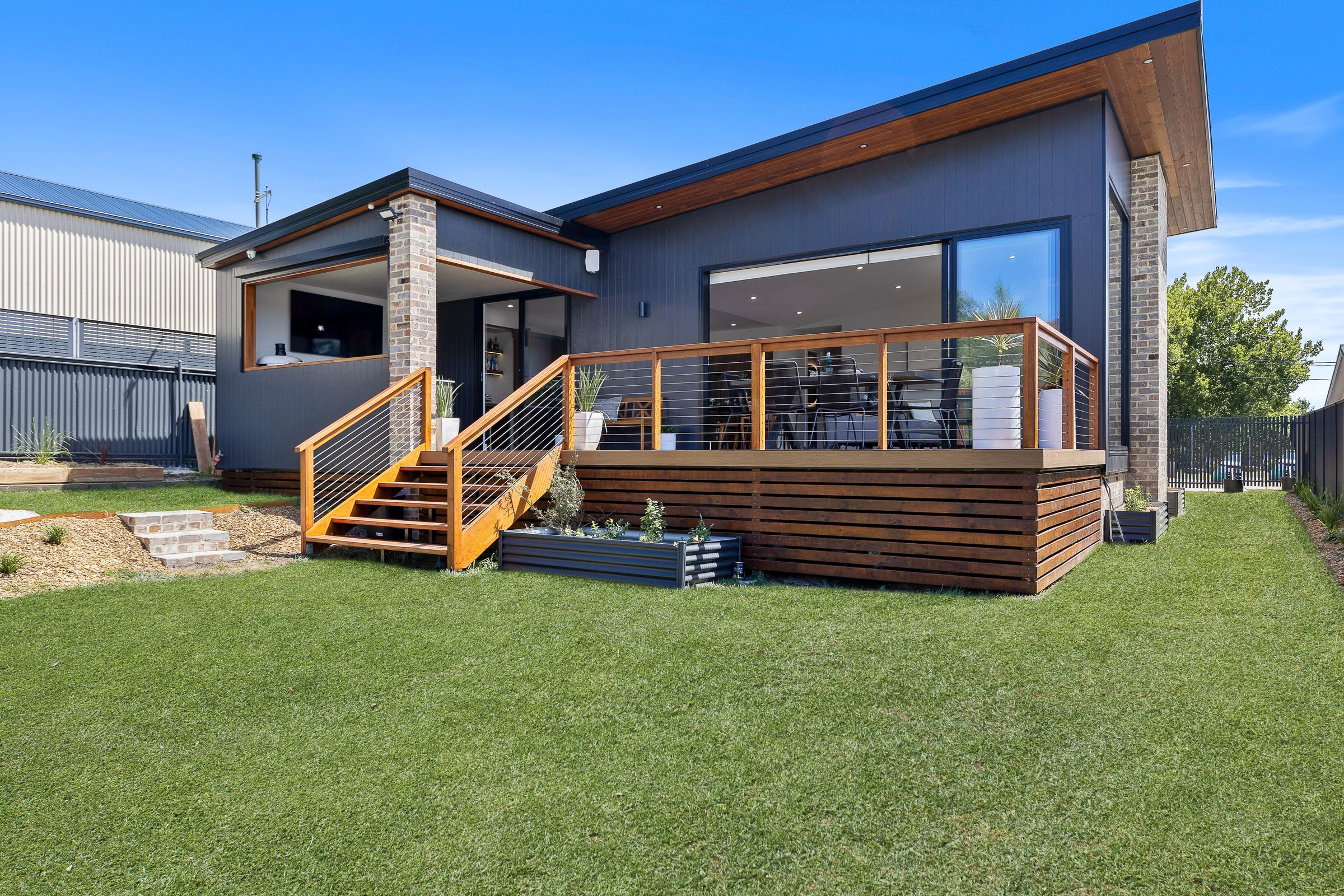 Park Parade, Lithgow: dark-clad rear extension with deck and lawn