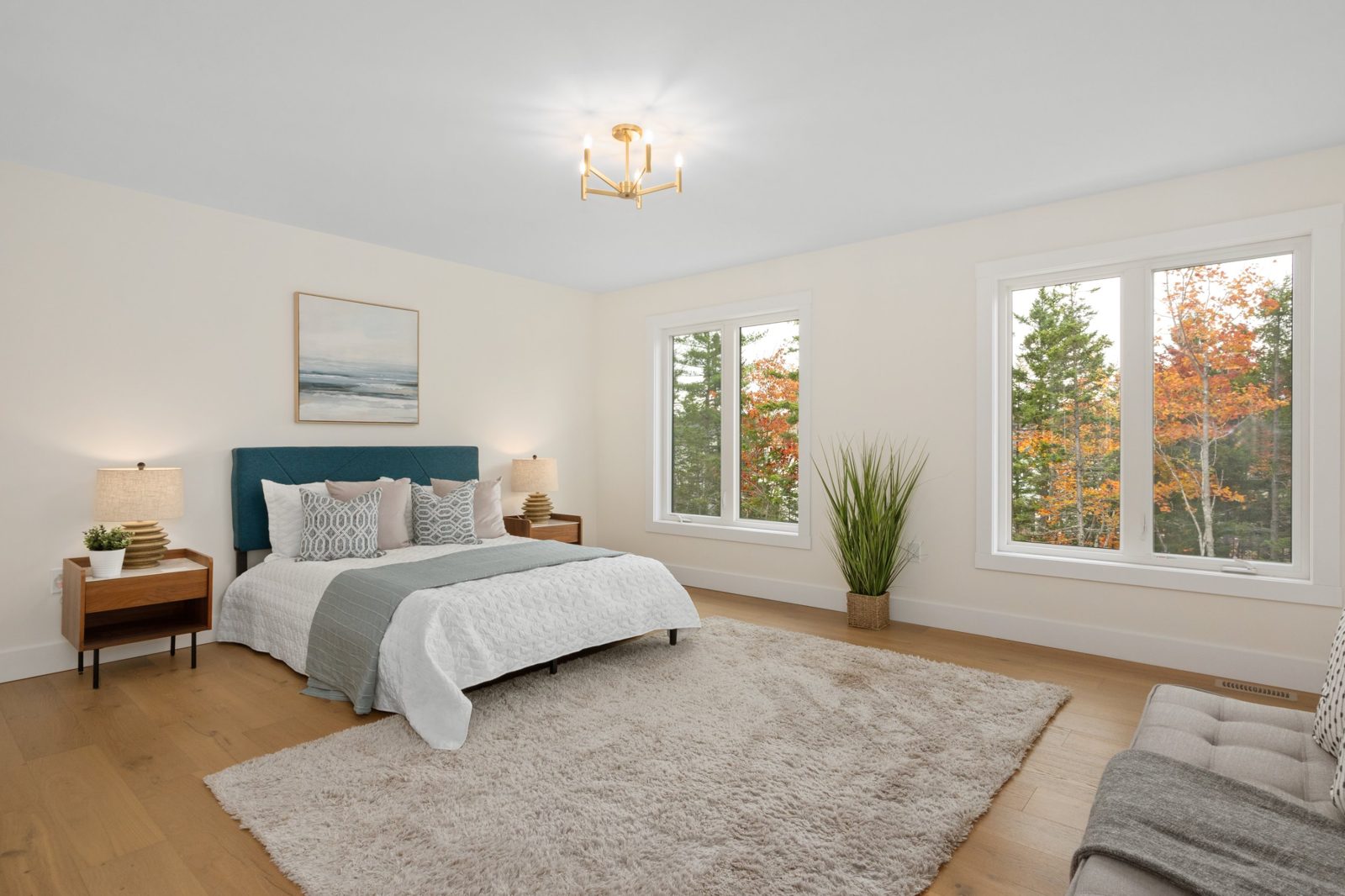 Primary bedroom with large windows and autumn trees in a Shaughnessy Homes new build