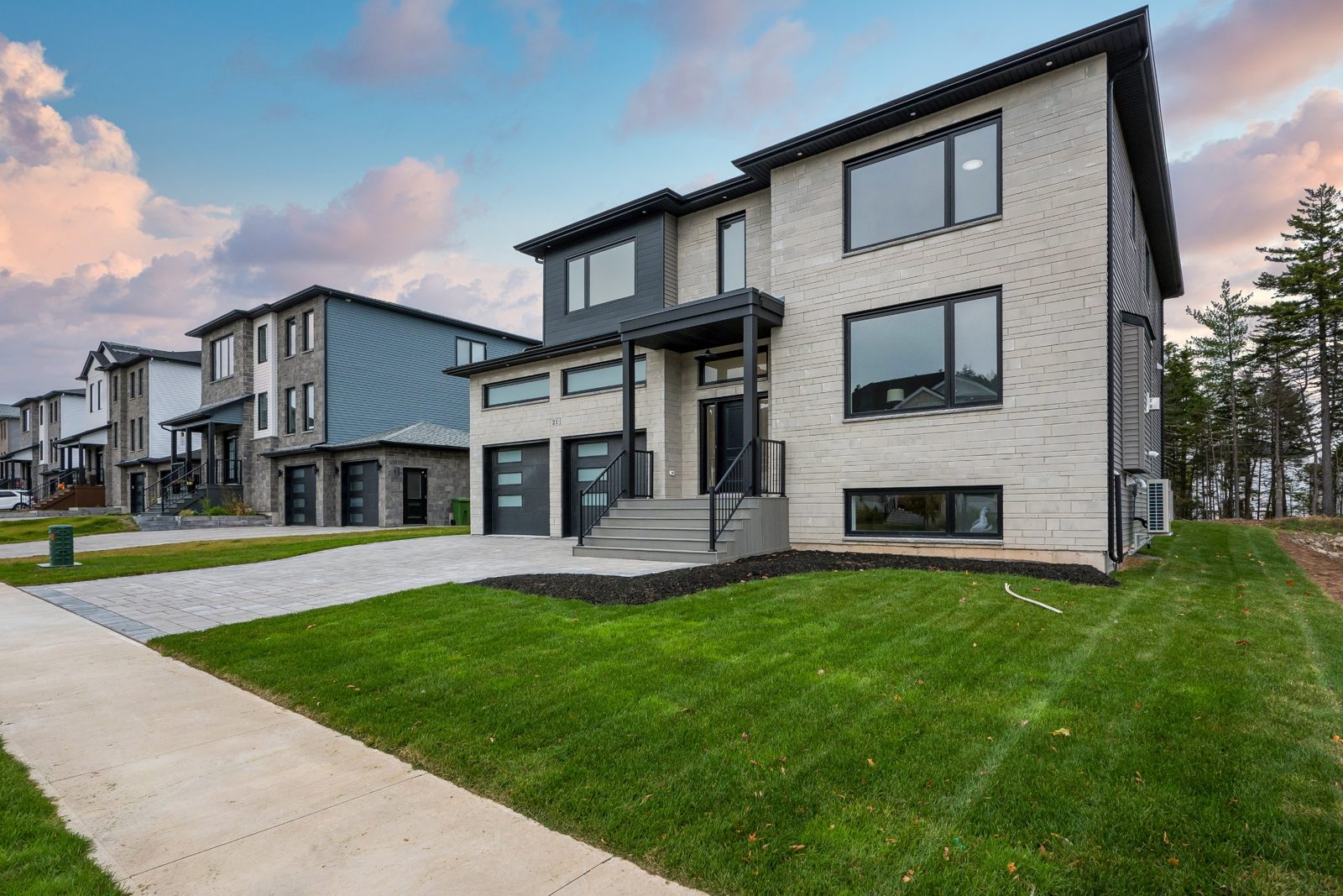 Modern Shaughnessy Homes exterior with stone facade and black trim, Halifax