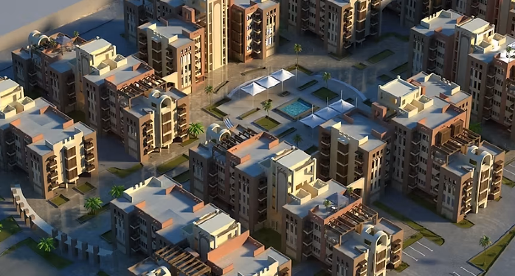 Aerial view of a residential development featuring multiple apartment buildings and landscaped communal spaces.