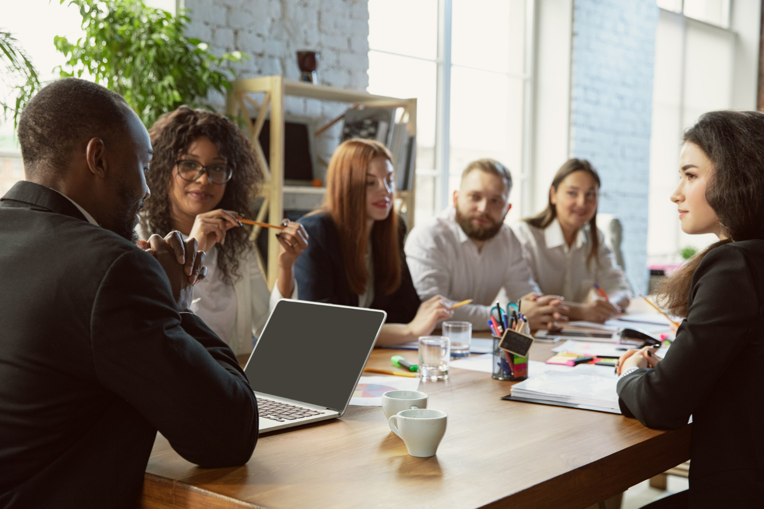 A leadership team meeting around a table