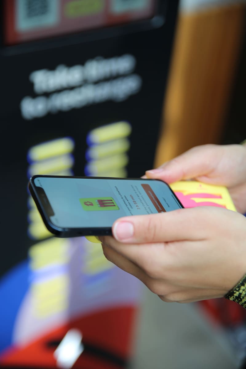 Phone being plugged into a OneFlash power bank