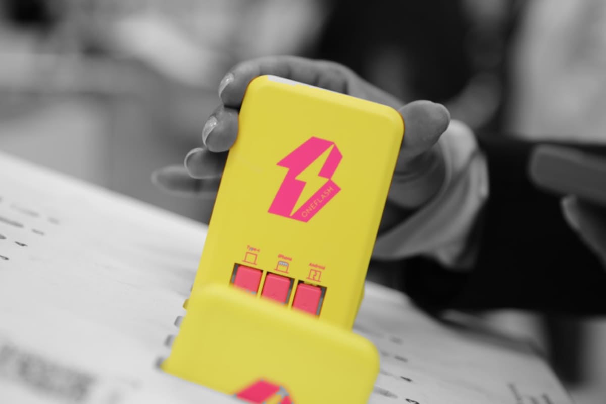Yellow power bank coming out of a OneFlash station