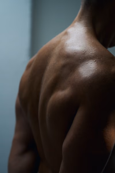 Shoulders and back of an athlete after a hybrid workout