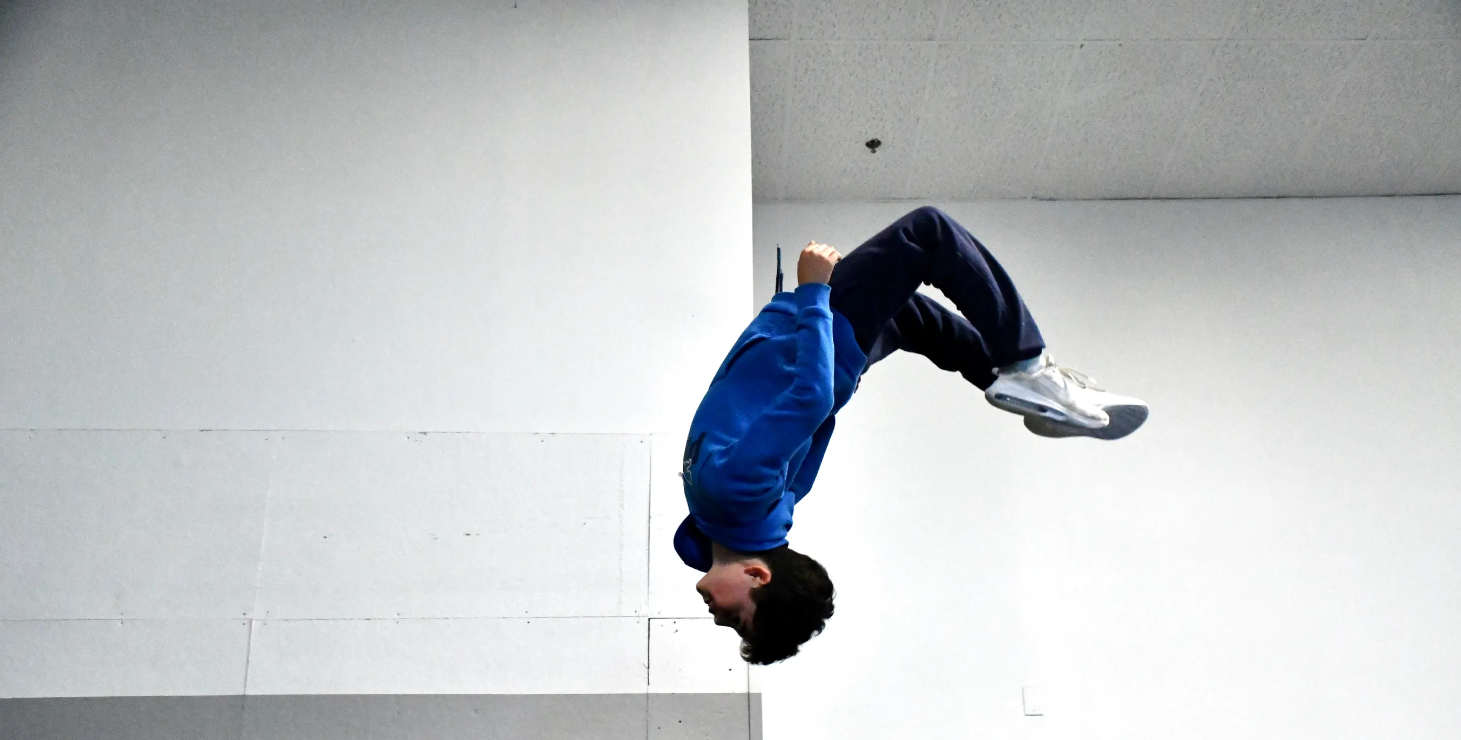 Athlete doing a backflip at Bolt Parkour