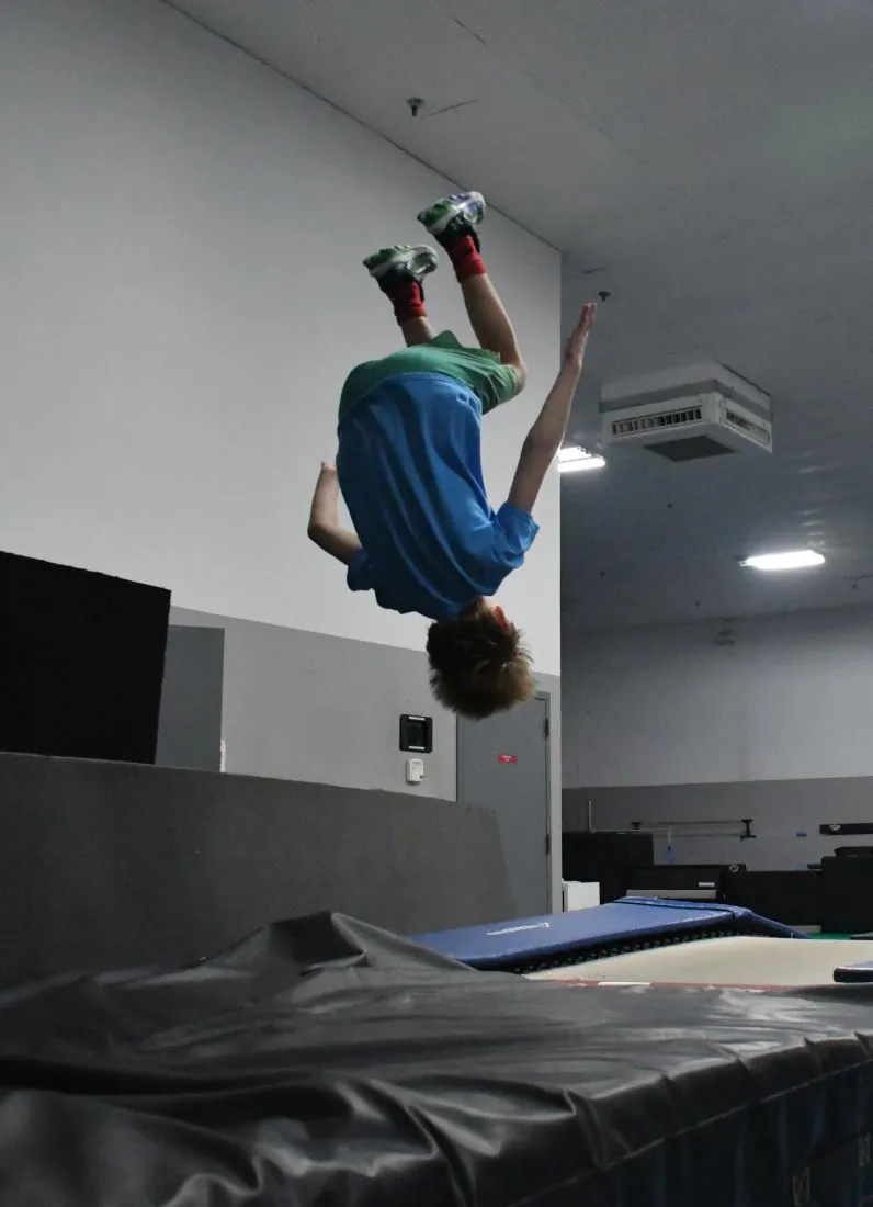 Advanced athlete mid backflip in Parkour and Freerunning