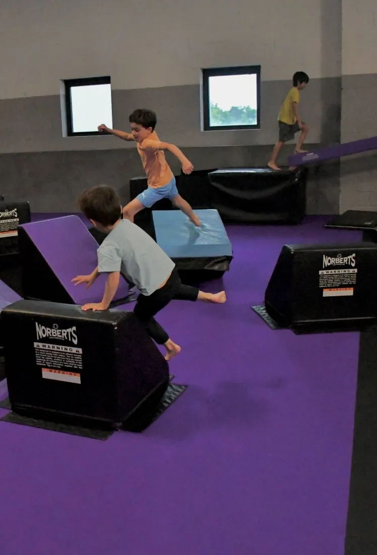 Kids vaulting soft blocks at Friday open gym at Bolt Parkour
