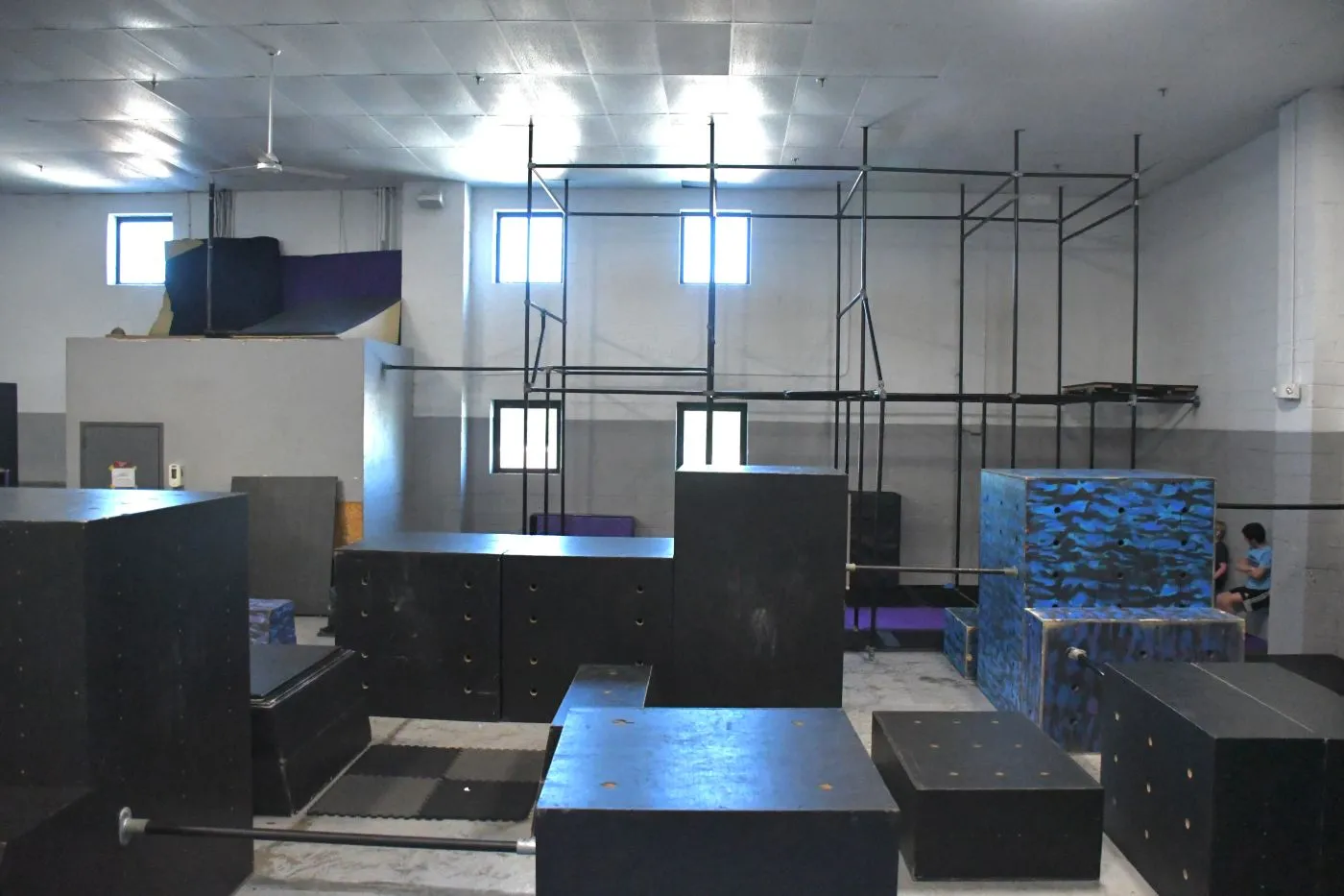 Parkour boxes and the steel rig on the Bolt training floor