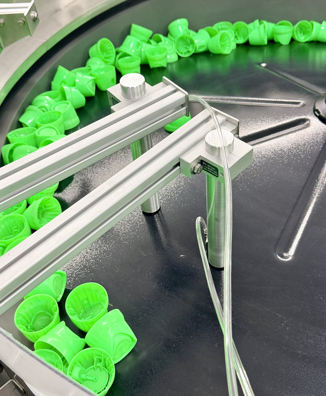 Centrifugal feeder sorting green bottle caps