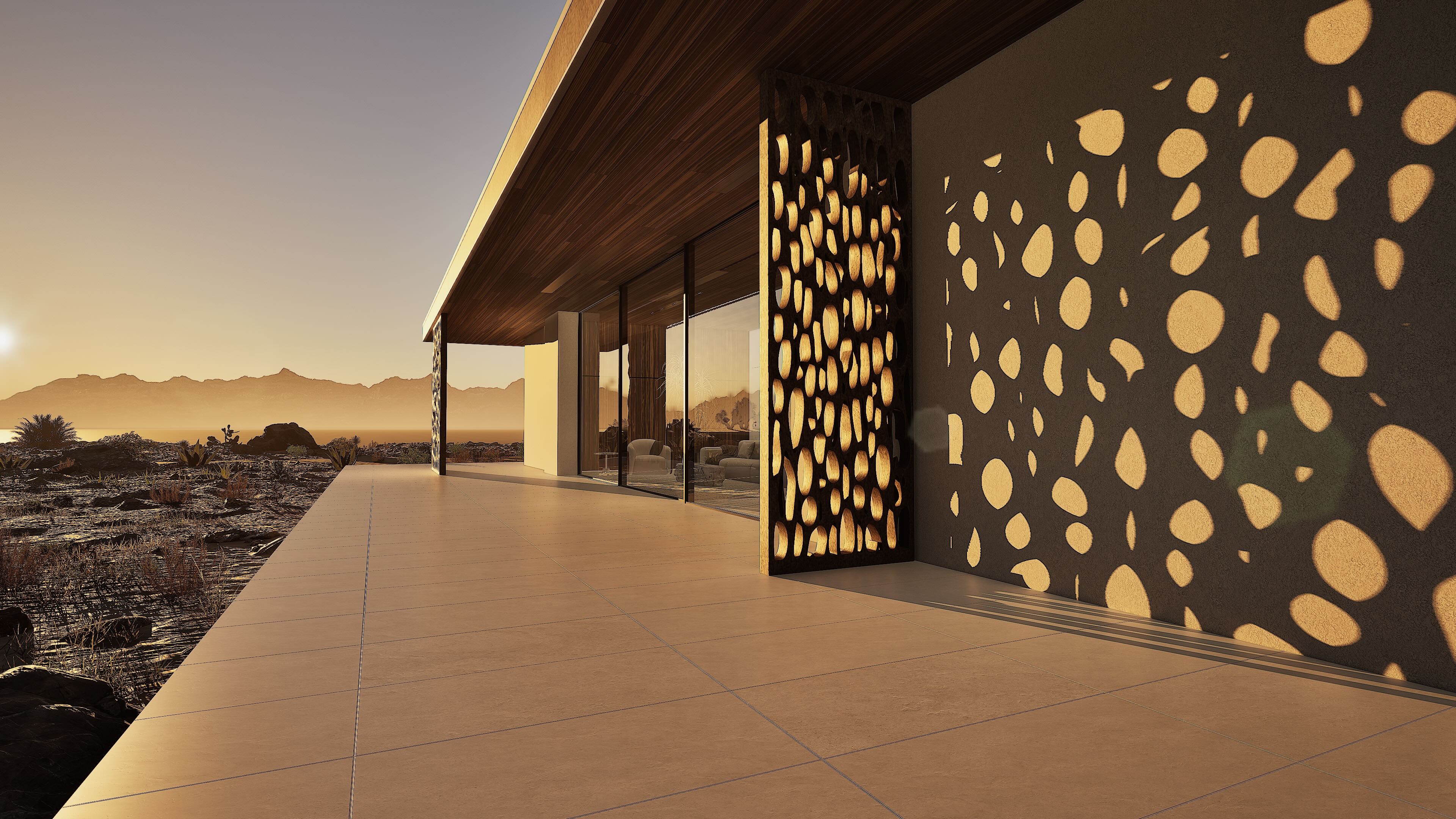 Cholla-inspired screen casting patterned sunset light across the terrace at Shadow Wash Pavilion by Mystic Sand in Twentynine Palms, California.