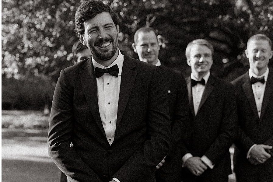 Black and white, the groom with his groomsmen