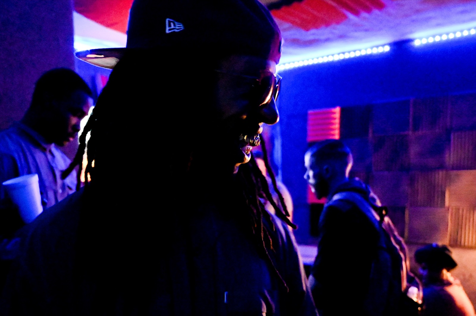 An artist in blue studio light