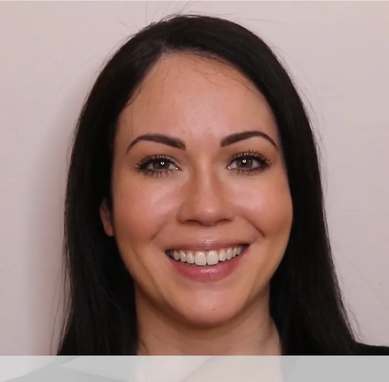 Smiling patient sharing her experience in a video testimonial for Queens Central Dental in Jackson Heights