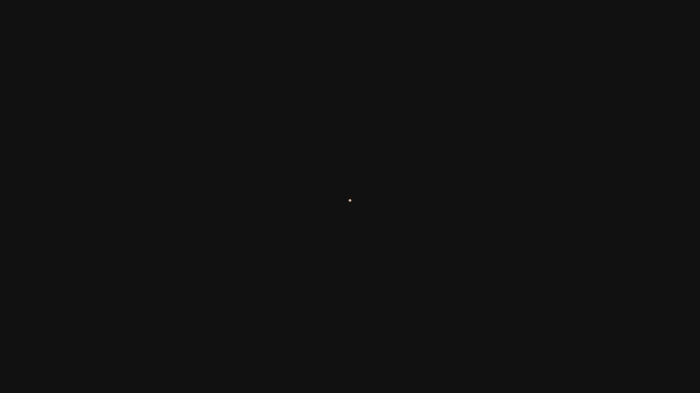An iris wipe: a circle opening from the middle of a dark frame to reveal a picture