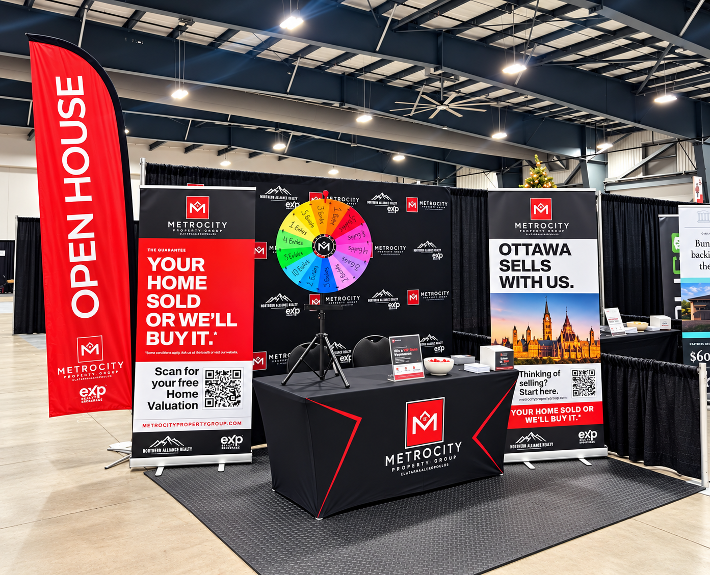 MetroCity Property Group booth at a home show, with an Open House flag and banners