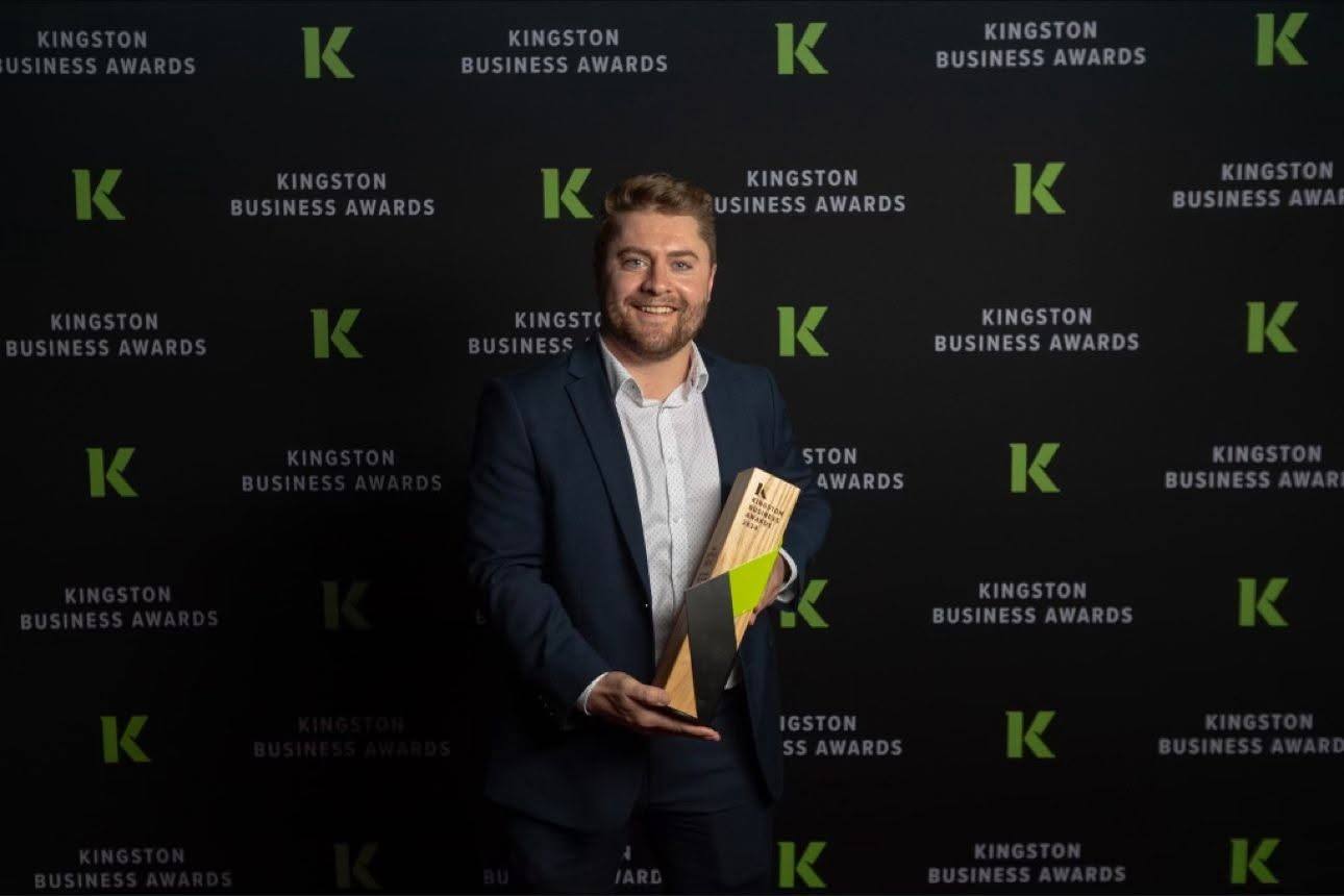 Darcy with the 2024 Young Entrepreneur of the Year award