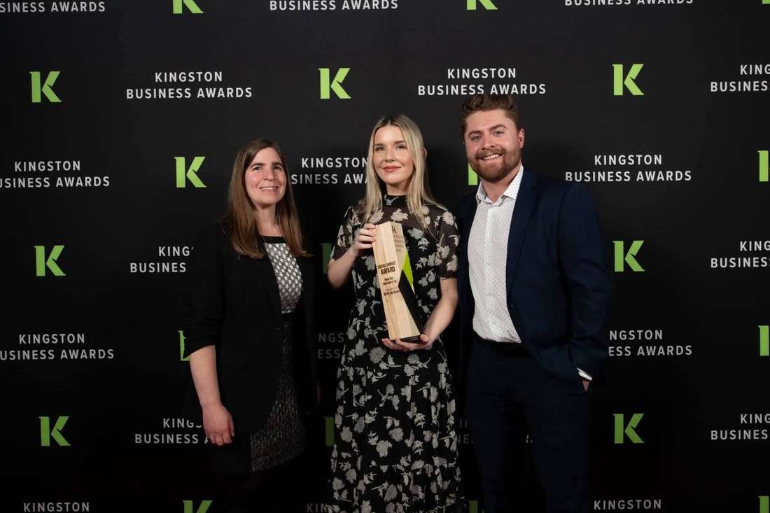 Christine and Darcy accepting the 2025 Social Impact Award at the Kingston Business Awards