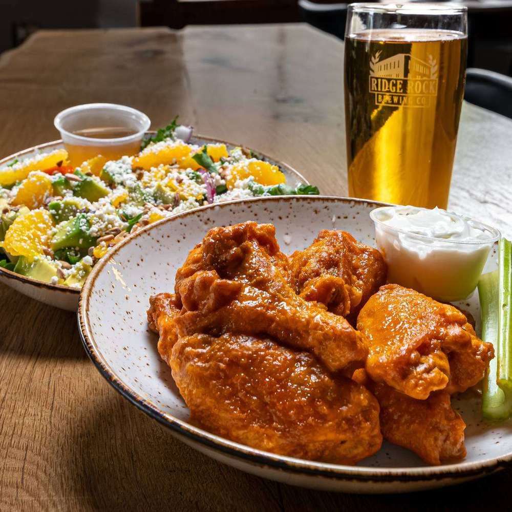 Wings and a pint by the window at Ridge Rock Brewing Co.