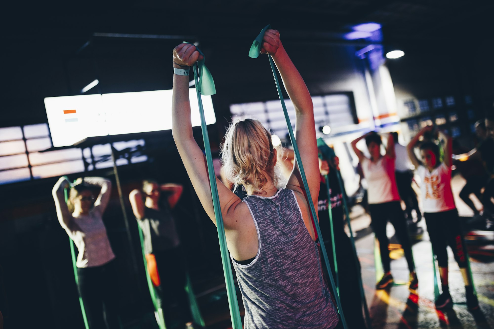 A group fitness class training with resistance bands