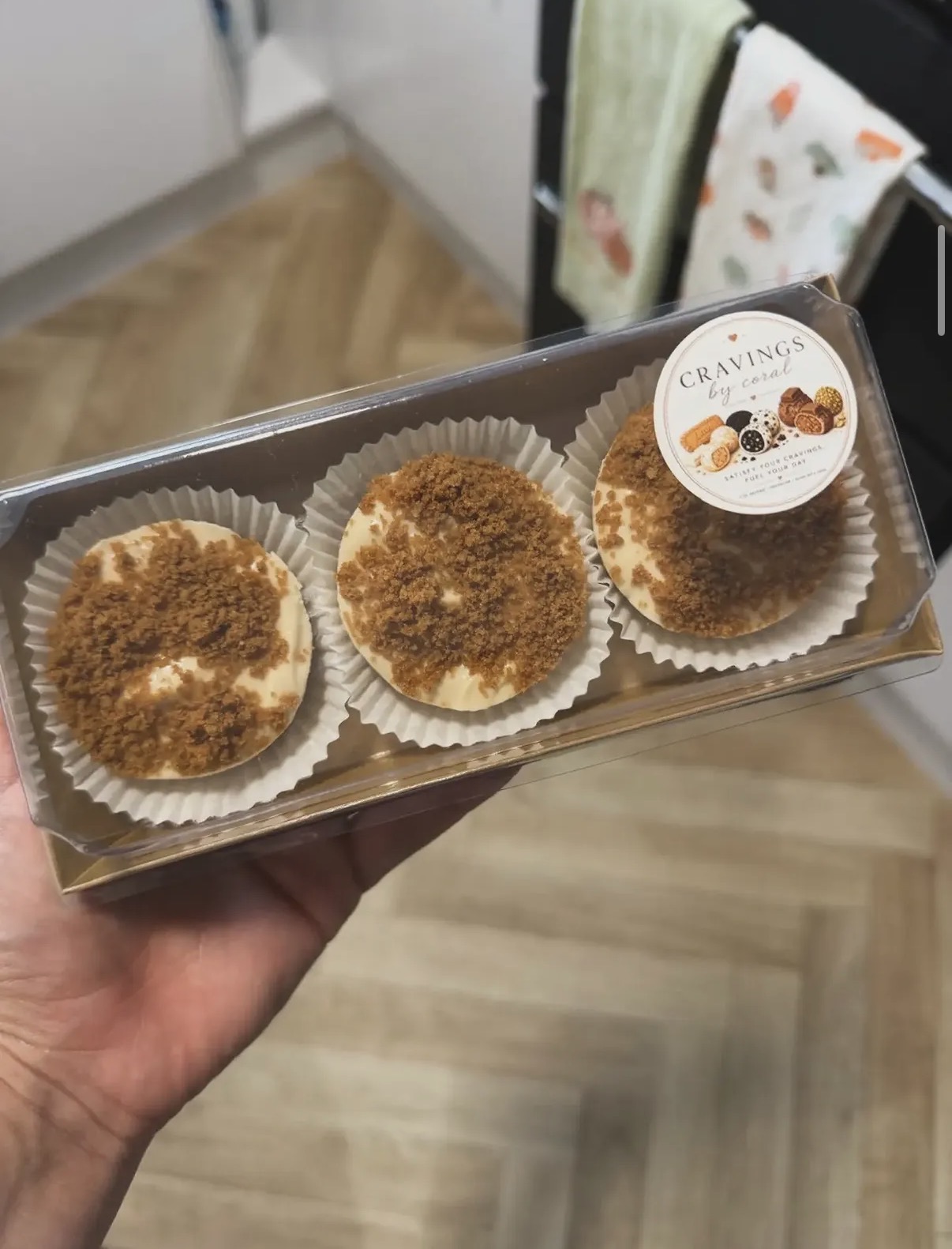 Three Lotus Biscoff mini cheesecakes in a box