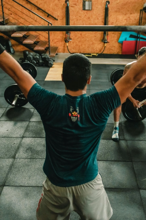A member setting up for a heavy barbell lift
