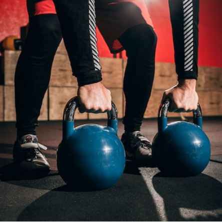 Kettlebells racked on the gym floor