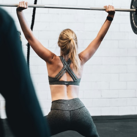 A member finishing a set of pull ups