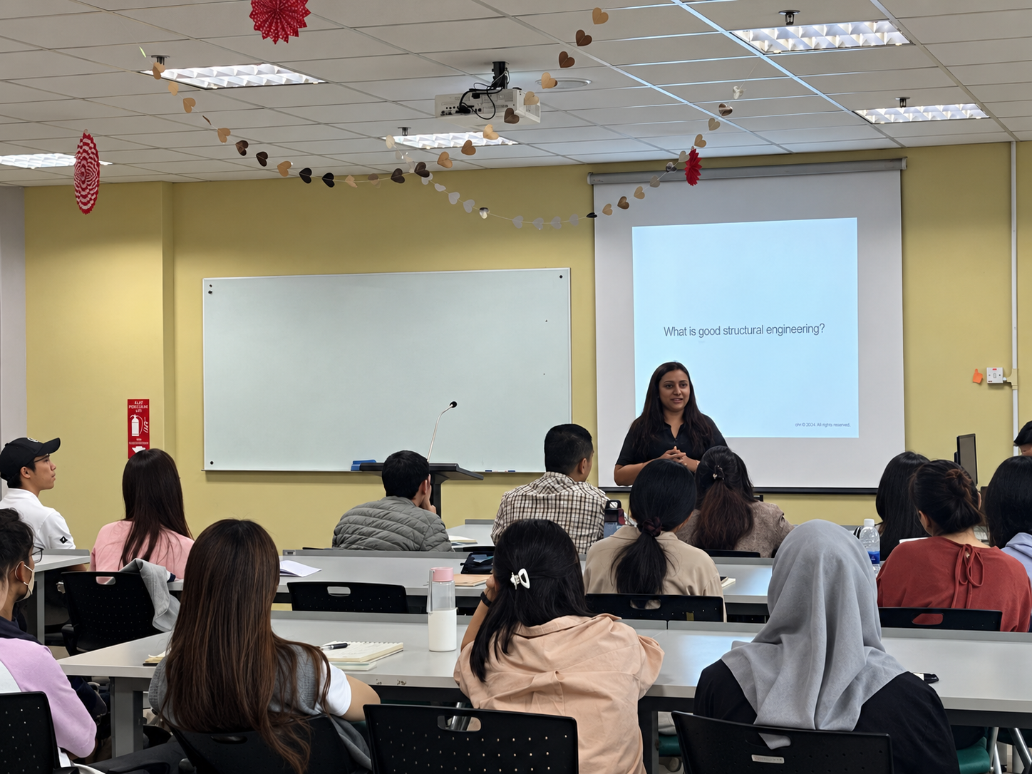 Yasotha Chetty delivering a lecture on structural engineering to university students