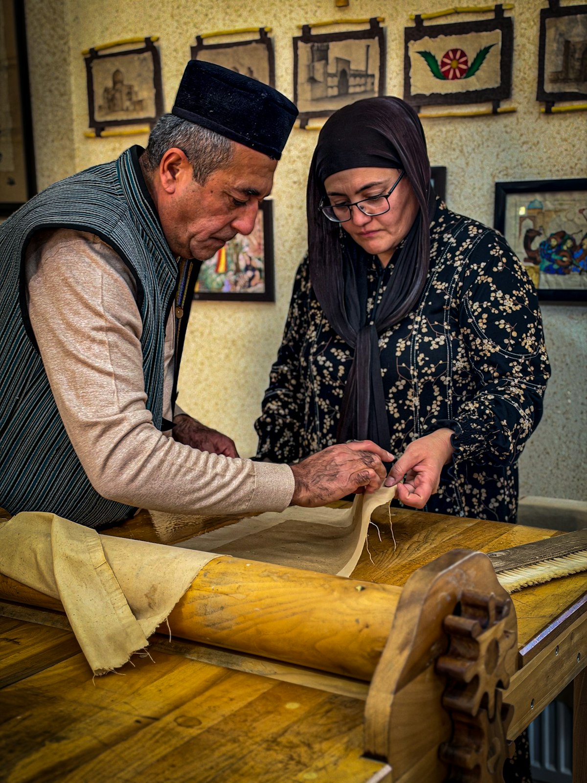 Local artisans working with fabric in a workshop