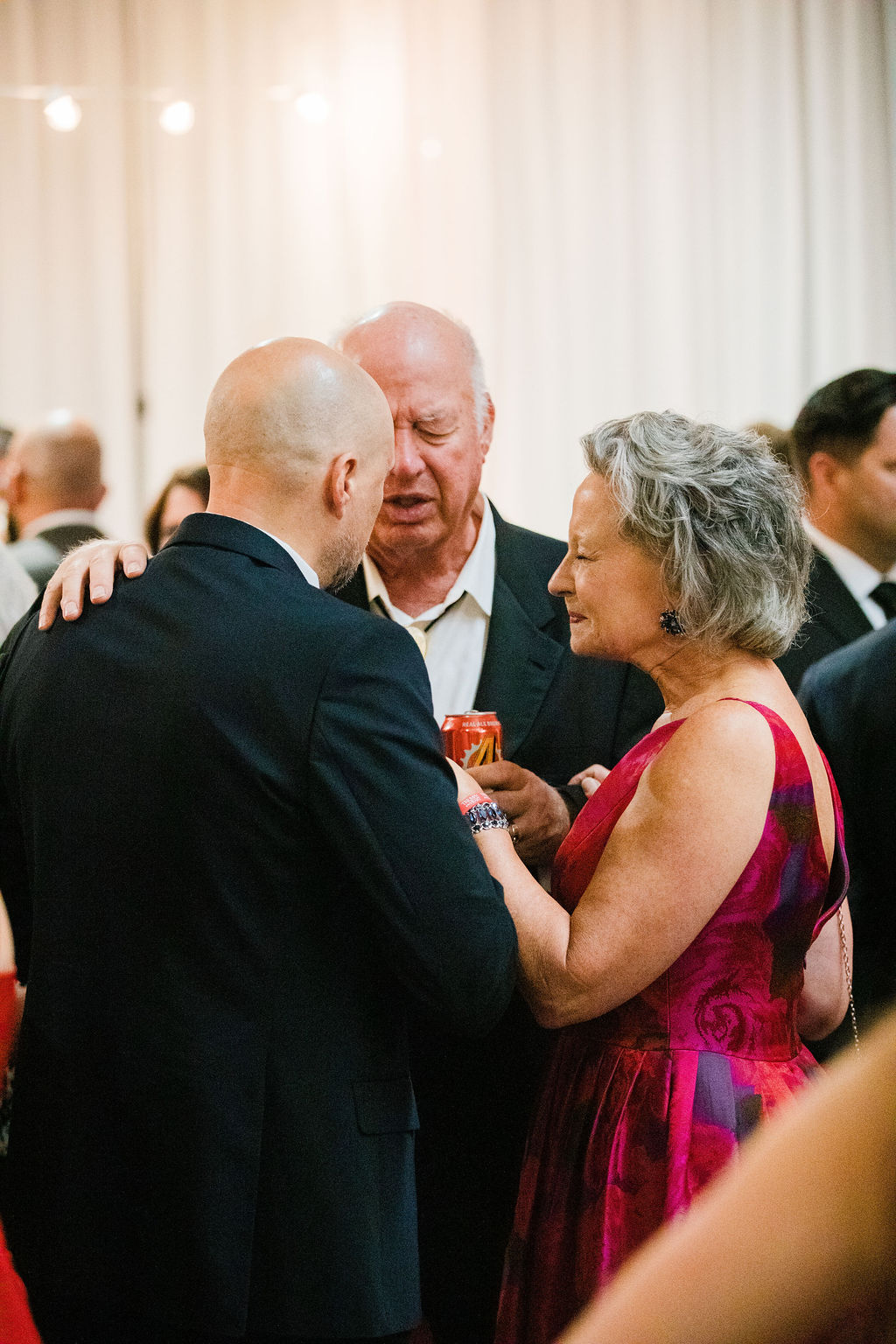 Guests embrace at the US premiere reception