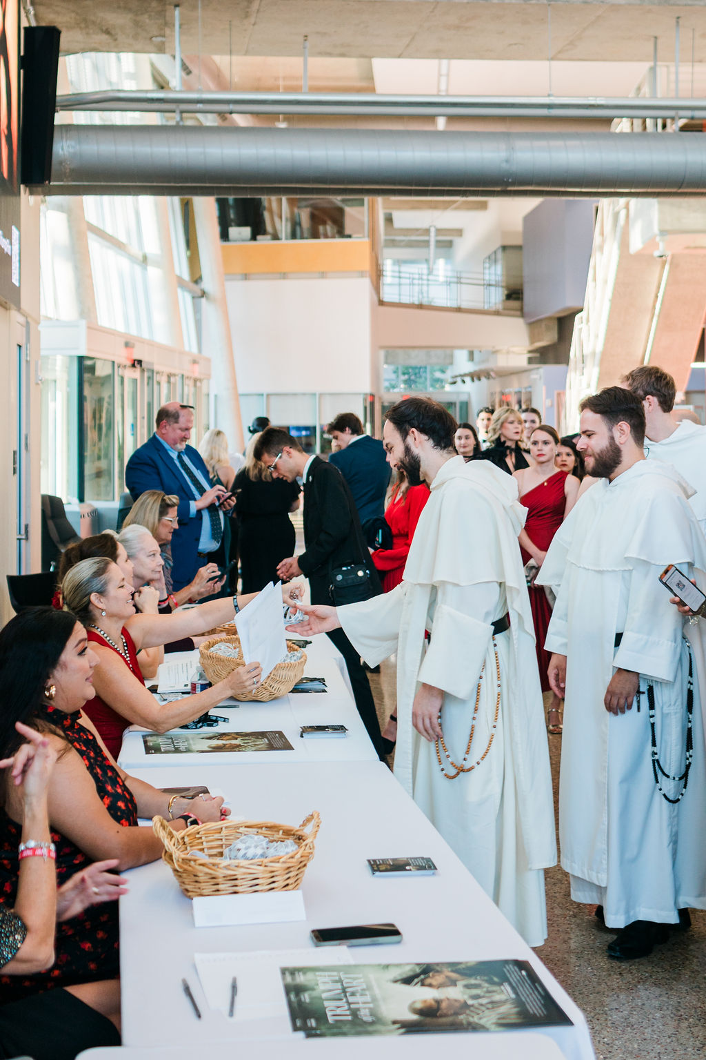 Guests checking in at a welcome table