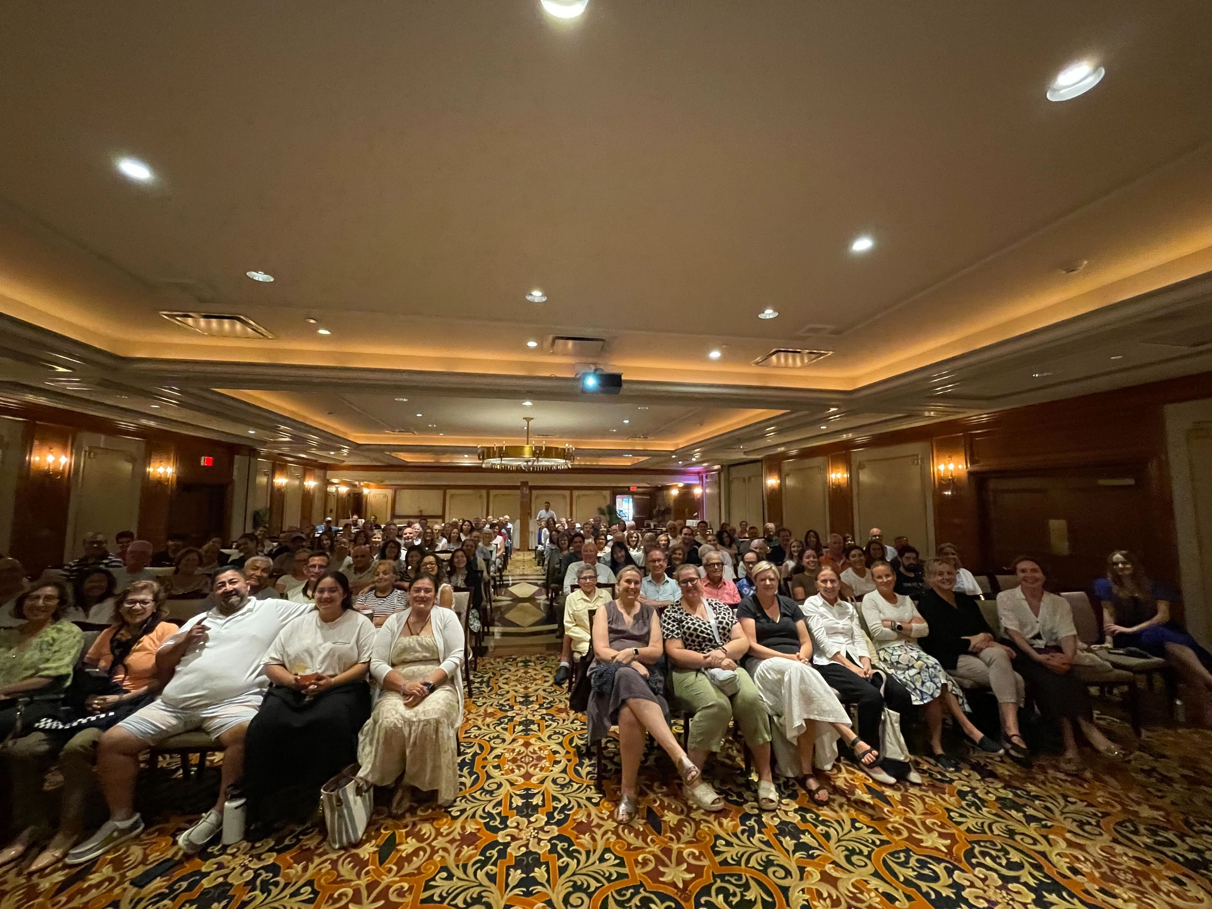 A full ballroom at a community screening of Triumph of the Heart