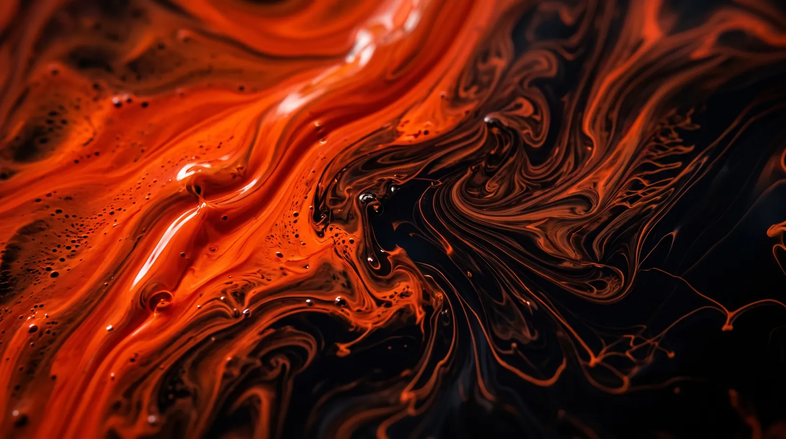 Orange paint swirling into black ink