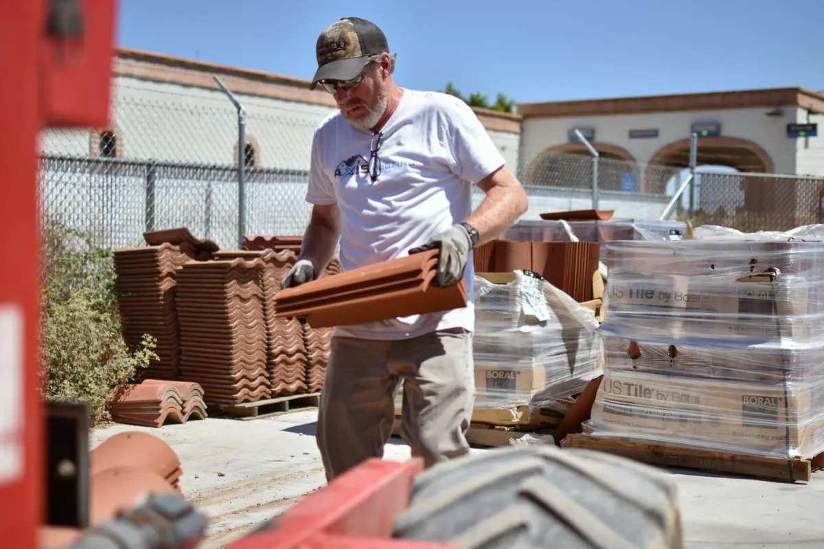 Operations Manager of Axis Roofing in the tile stock yard of Axis Roofing outside the office in Mesa, Arizona