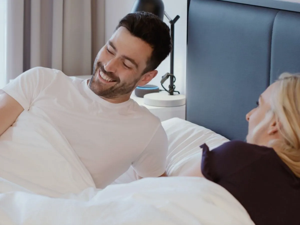 A man resting comfortably in bed