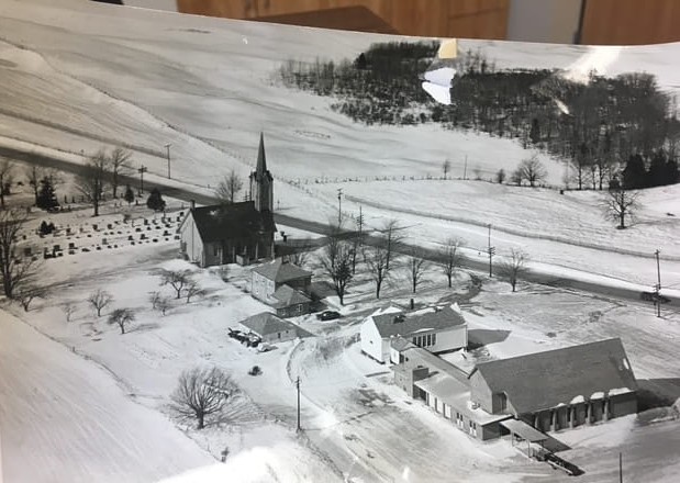 A black and white aerial photo of St. John's Lutheran Church in Algoma, Wisconsin