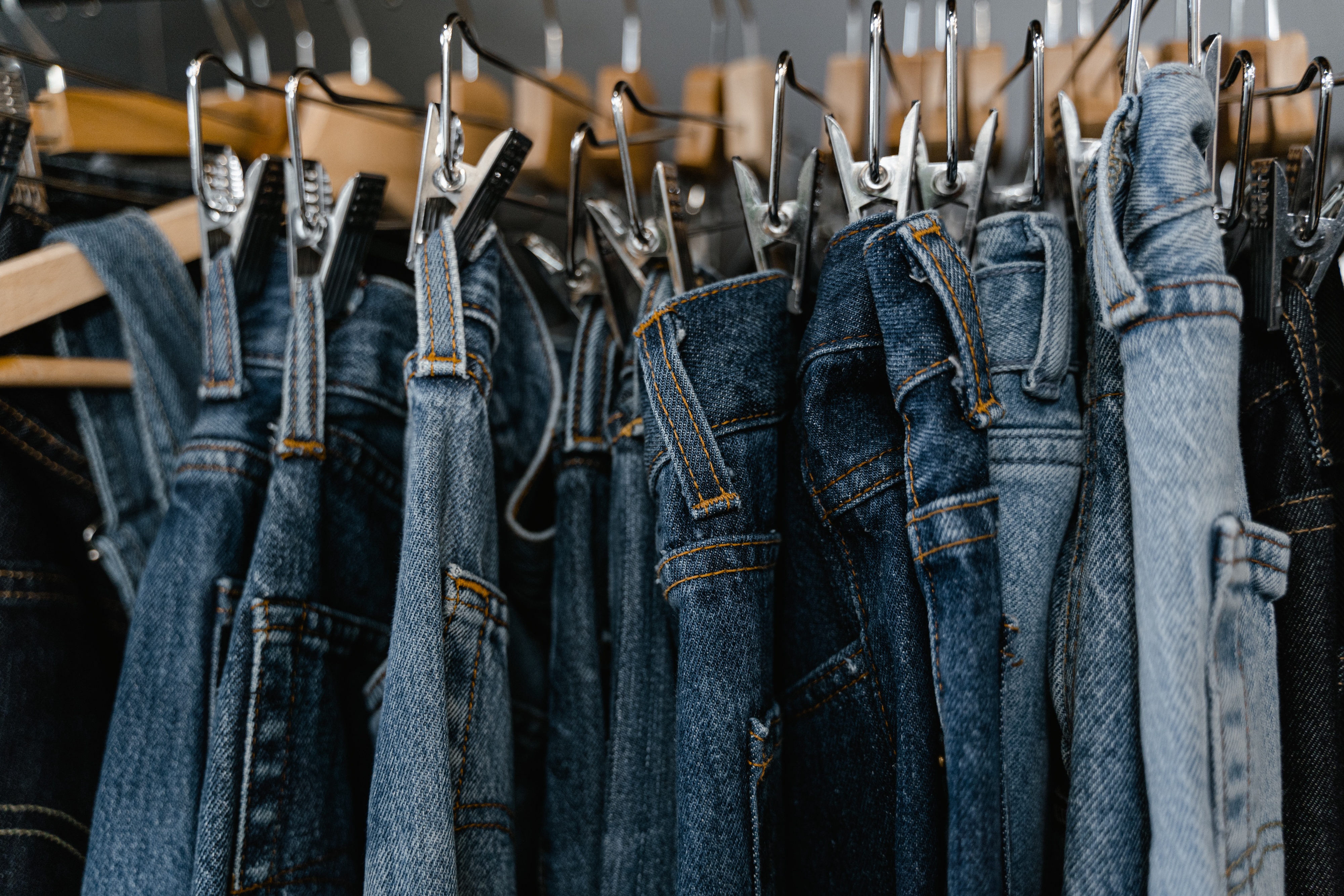 Jeans on clothing rack stock photo