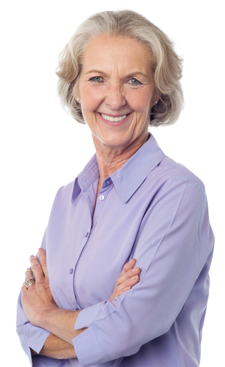 A cheerful older woman wearing a purple shirt, smiling warmly at the camera, exuding joy and positivity.