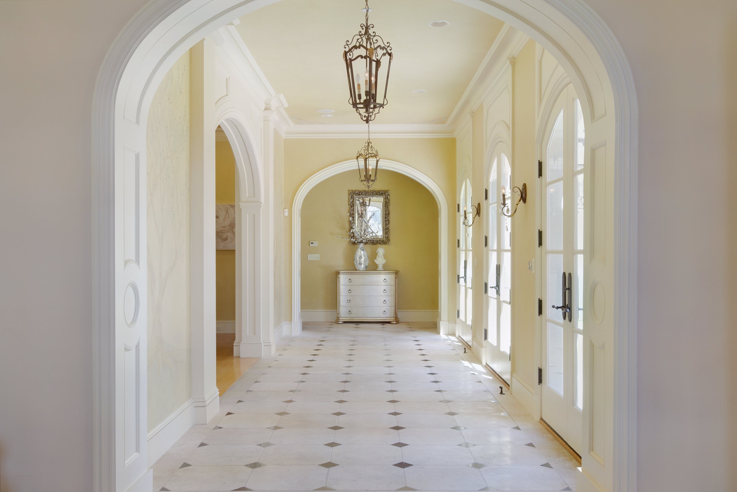 An arched gallery hall with a stone floor, San Francisco Bay Area. Real estate photography by Lumiful Media
