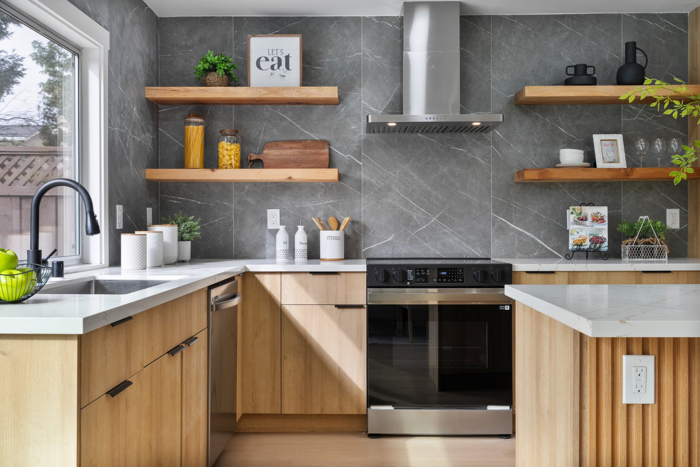 A kitchen with oak cabinets and floating shelves, San Francisco Bay Area. Real estate photography by Lumiful Media