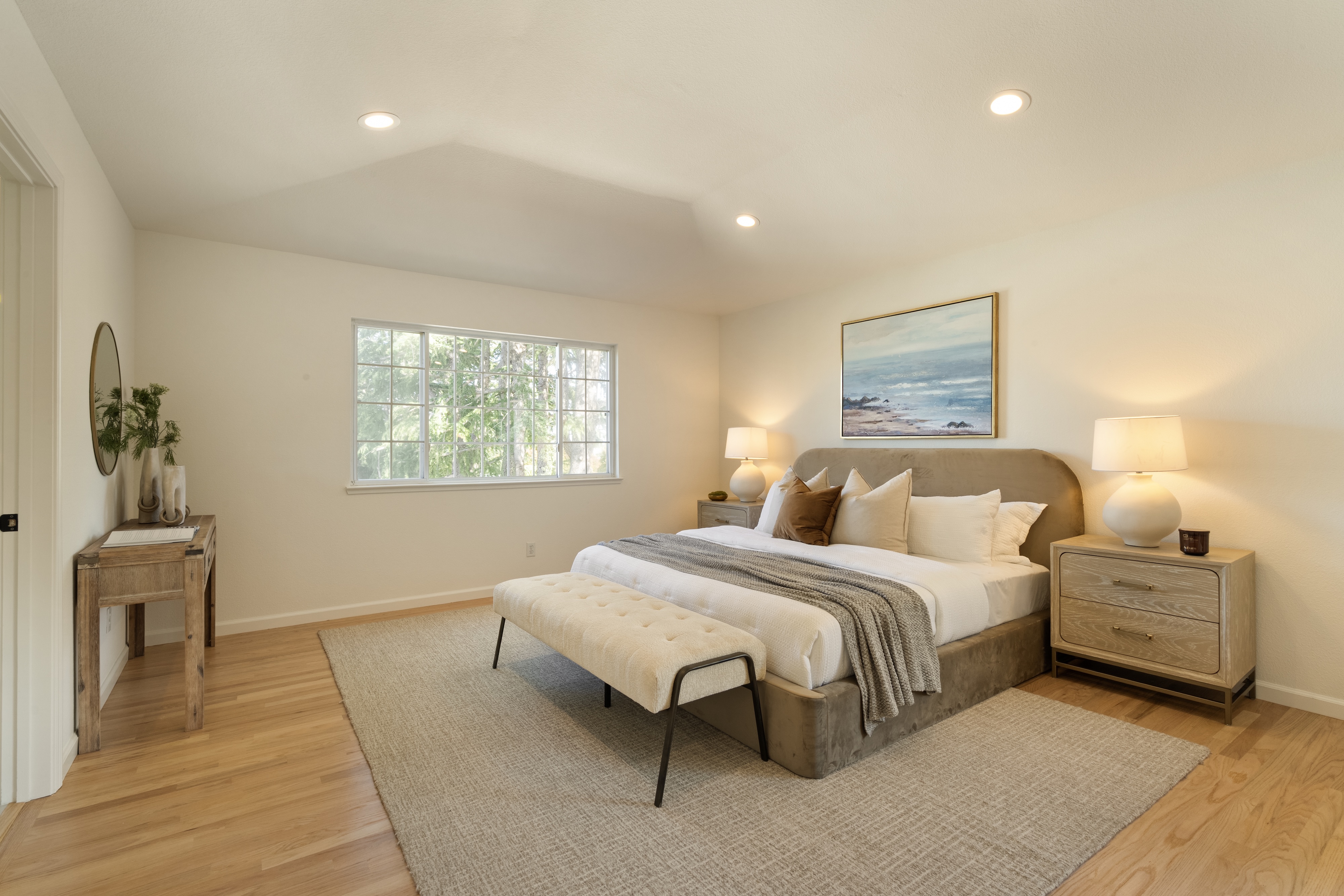 A primary bedroom with a tufted bench, Cupertino. Real estate photography by Lumiful Media