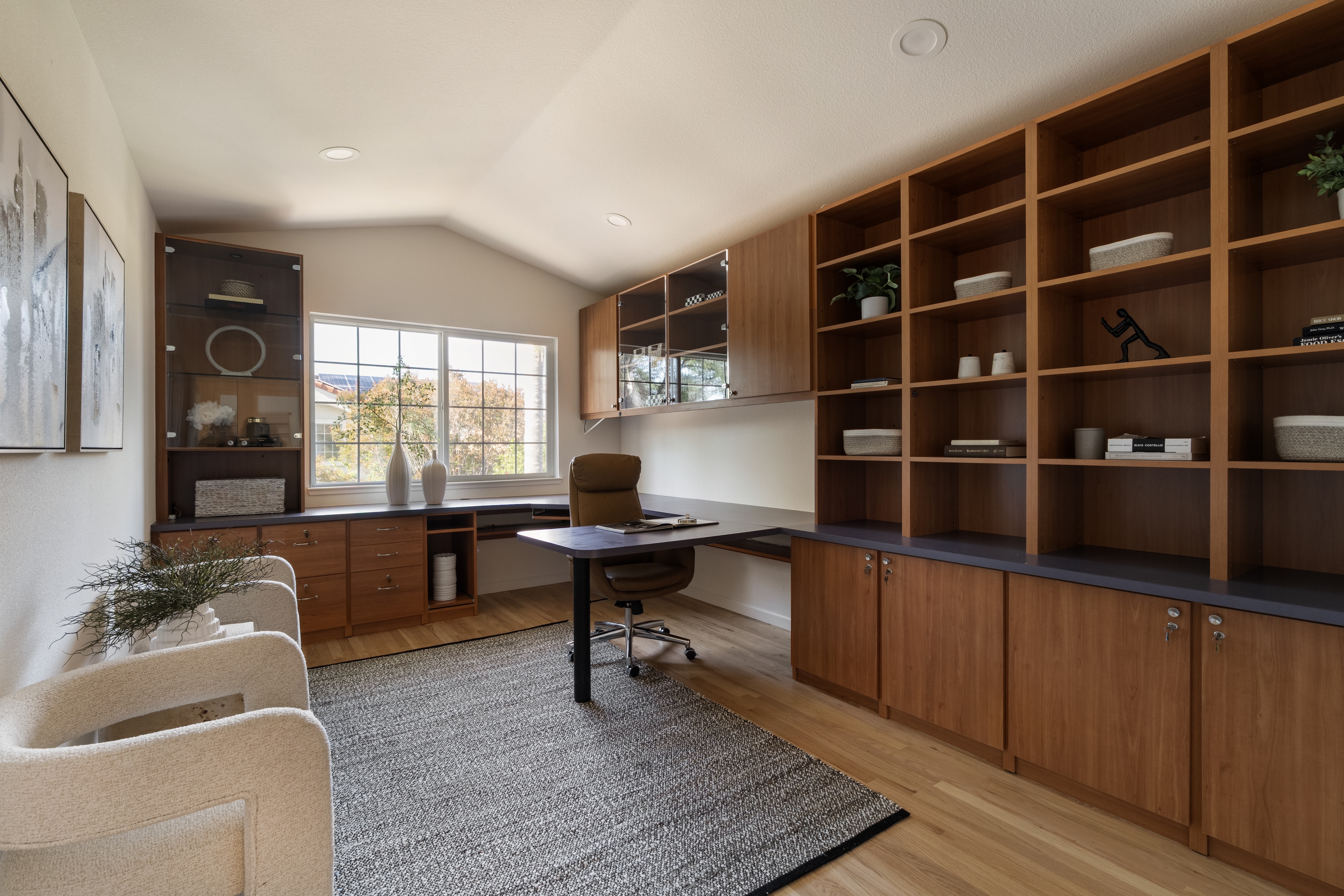 A home office with built in wood shelving, Cupertino. Real estate photography by Lumiful Media
