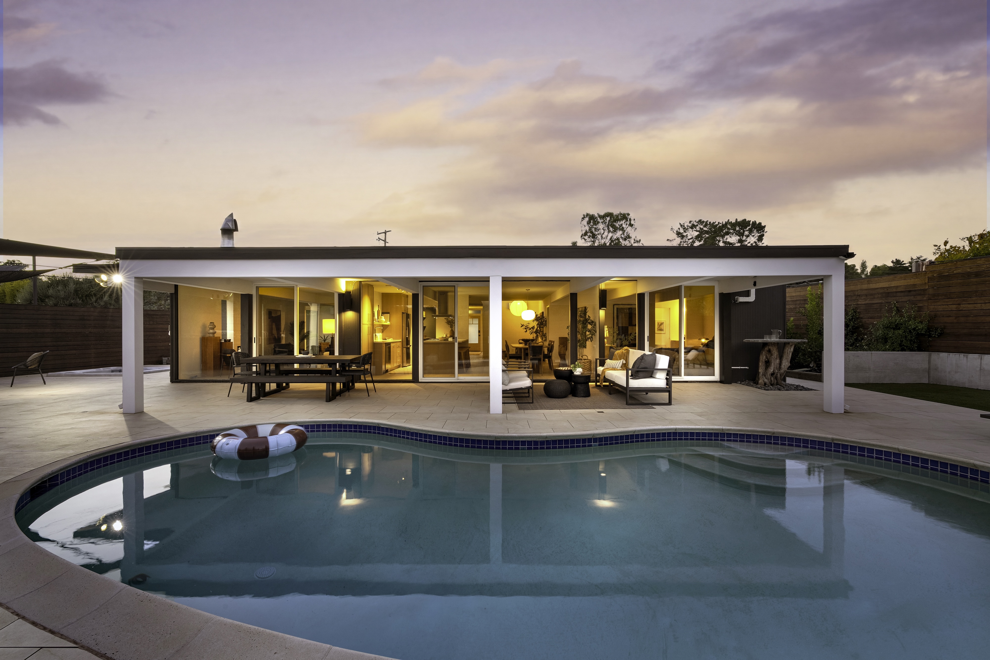 The same midcentury home and pool at twilight, San Rafael. Twilight real estate photography by Lumiful Media