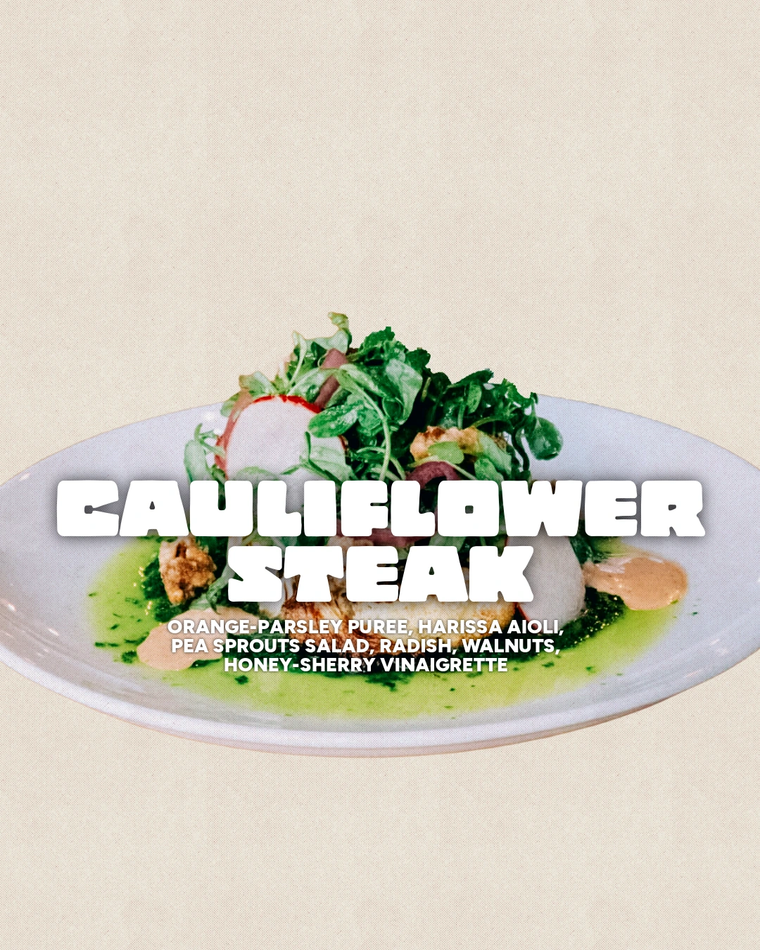 Cauliflower steak dish card with the plate low in the frame against a cream field.