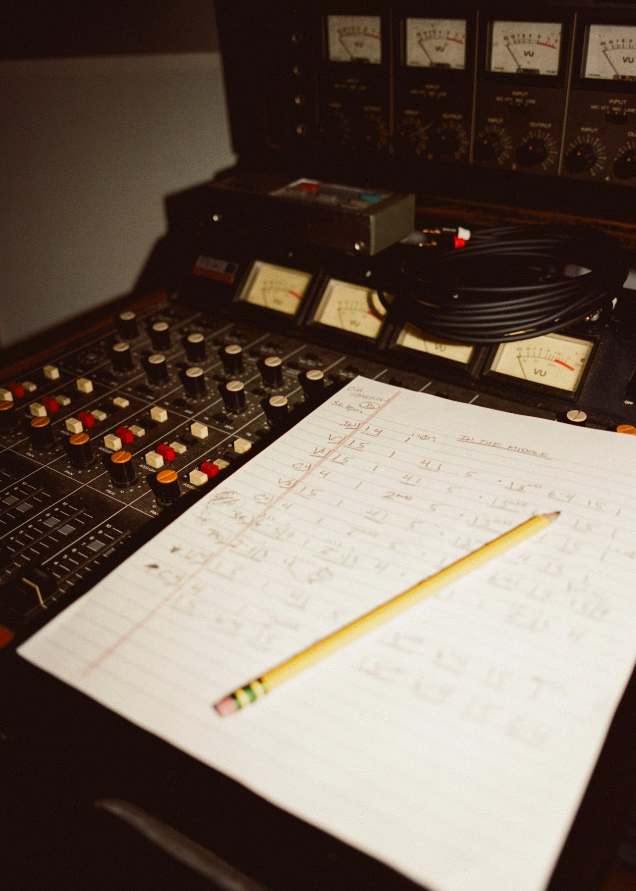 A handwritten chart on an analog recording console