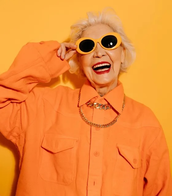 Older woman smiling in sunglasses