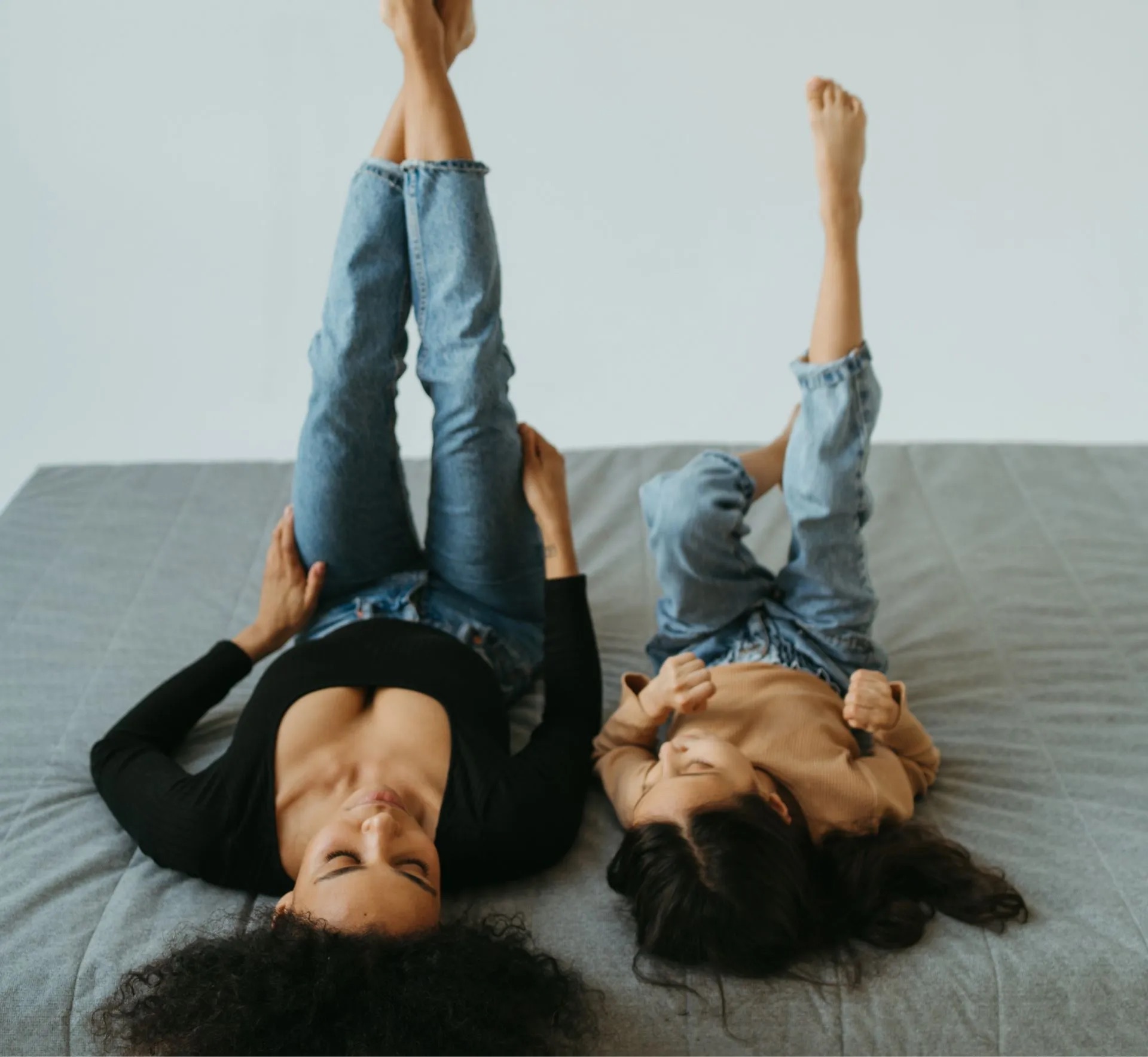 Mother and daughter relaxing together at home